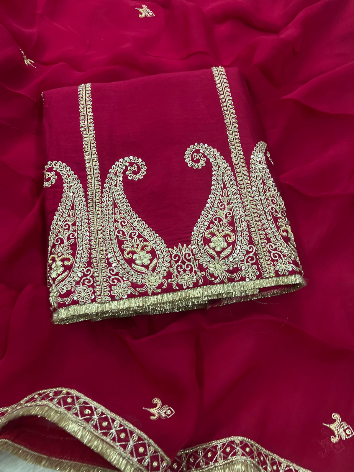 Maroon silk unstitched suit set with gold paisley embroidered border and dupatta