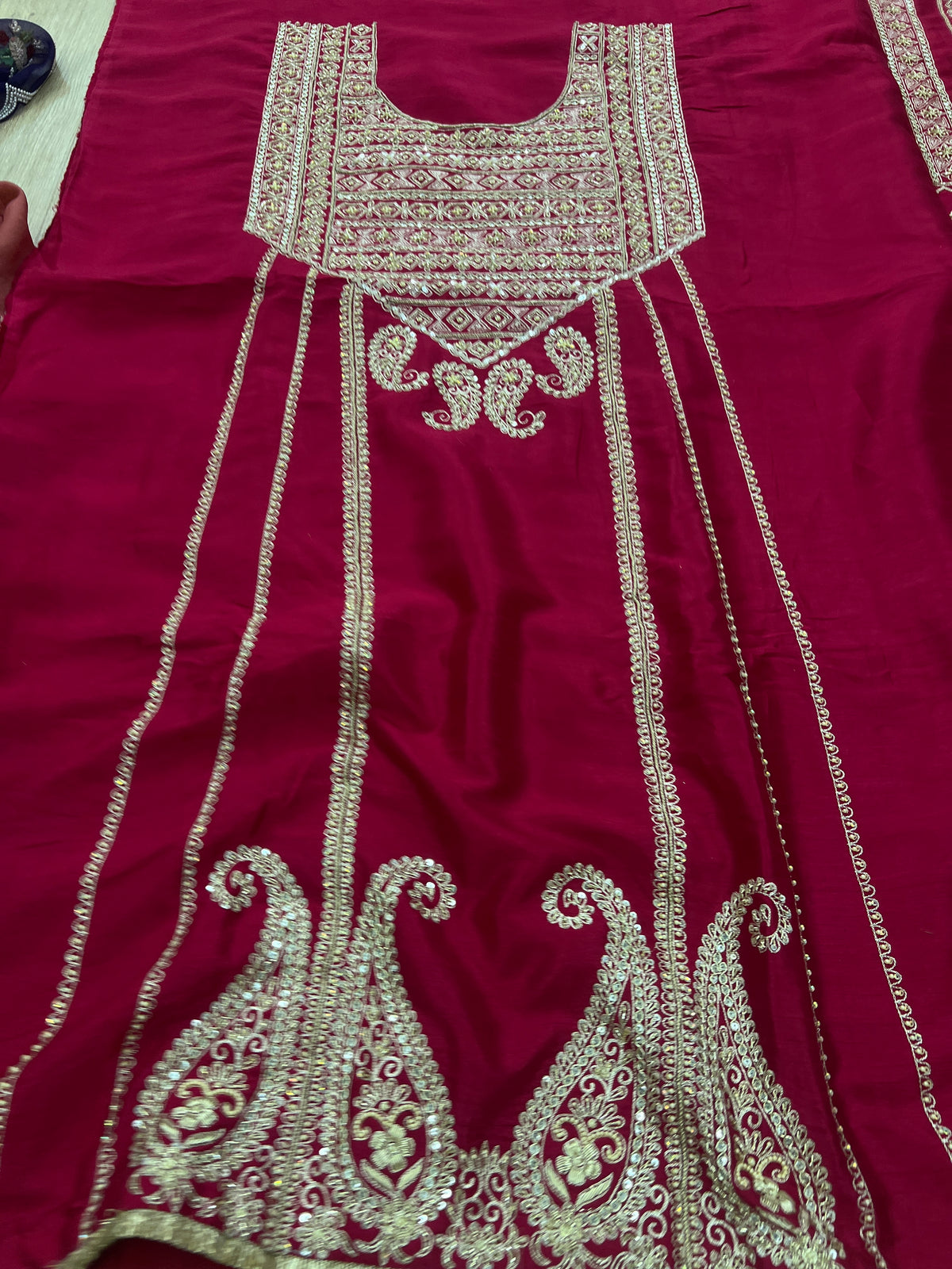 Maroon silk kurta fabric with embroidered yoke, long panels and paisley hem border