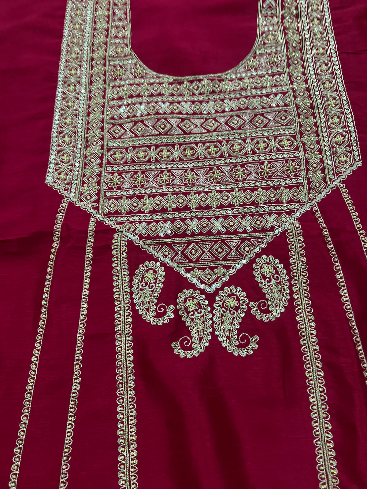Embroidered neckline yoke with geometric zari work and paisley motifs on maroon silk